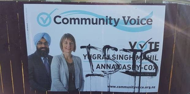 Community voice defaced billboard
